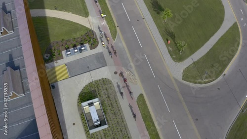Group of cyclists on the city street aerial view