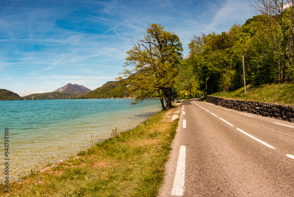 Scenic Lakeside road with mountain background