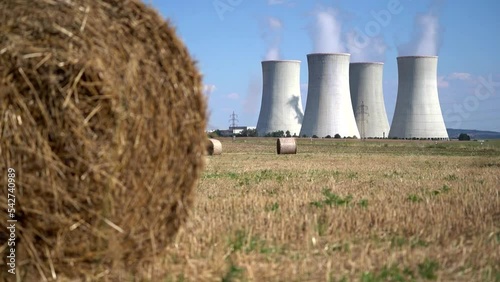 Cooling towers at nuclear power plant, energy self-sufficiency, greenhouse emission reduction and global warming concept photo