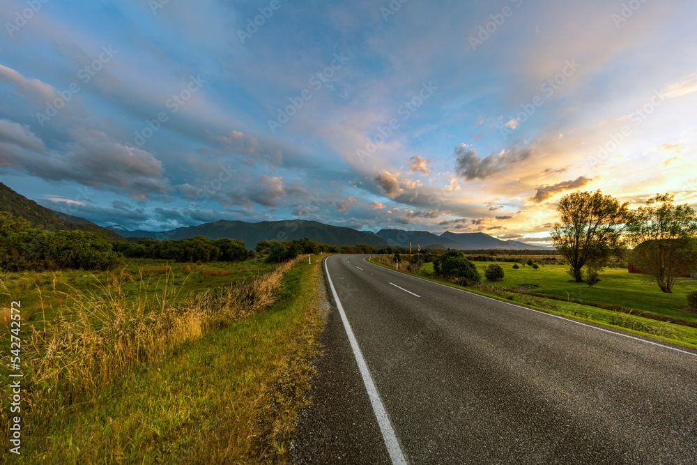 Scenic Lakeside road with mountain background