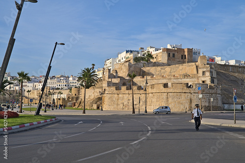Wall of Tangier with a random police officer walking on the street