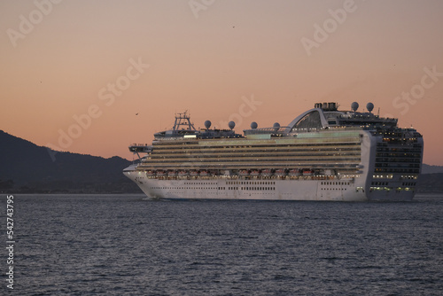 Princess cruiseship or cruise ship liner Ruby P in San Francisco port Bay terminal sail away cruising with Sausalito skyline twilight blue hour sunset sky Alcatraz Golden Gate sailing boats yachts photo