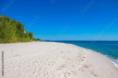 Beach with white sand near mountain Pivikha situated on the shores of Kremenchuk water reservoir near Svitlovodsk  Kirovograd region  Ukraine. Natural background in a sunny summer day.