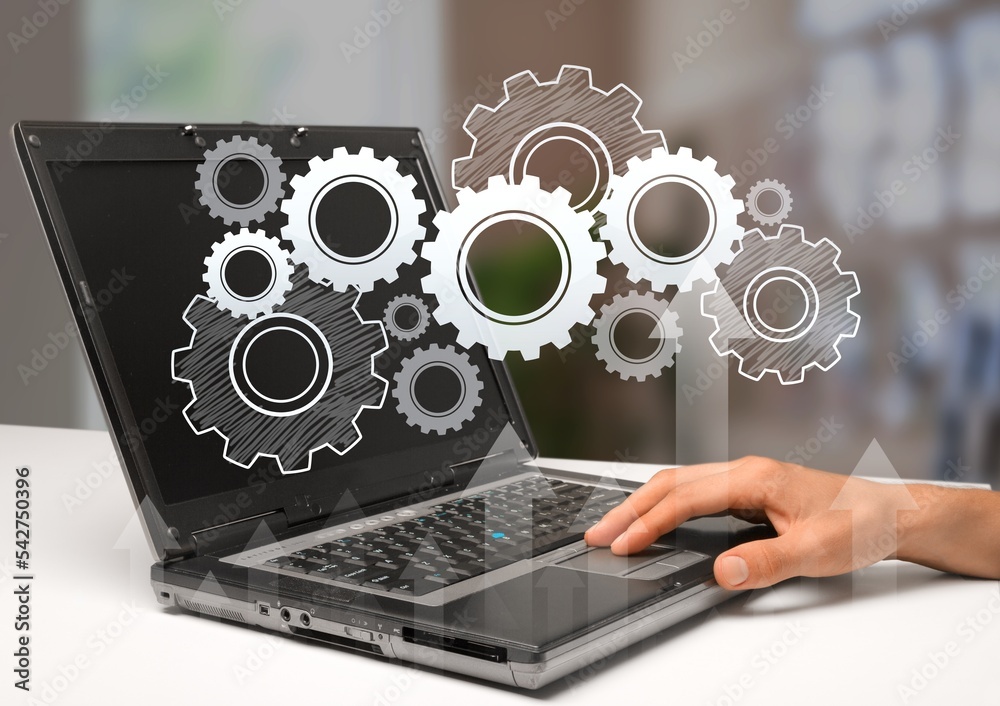 Business person works on laptop in office Business person works on laptop in office