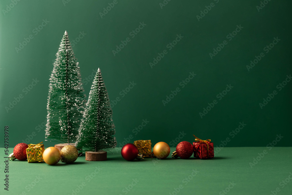 Festive Christmas scene podium for products showcase, promotional sale, minimalist green background - obrazy, fototapety, plakaty 