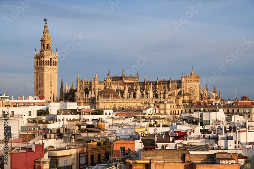 view over the roofs of seville to the cathedral at sunset