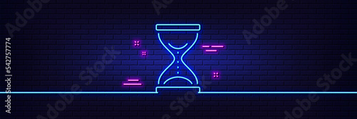 Neon light glow effect. Time hourglass line icon. Sand watch sign. 3d line neon glow icon. Brick wall banner. Time hourglass outline. Vector