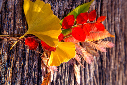 Composition of colorful autumn leaves on a wooden table. Floral composition of autumn leaves. The concept of nature, floristry, textures and backgrounds.