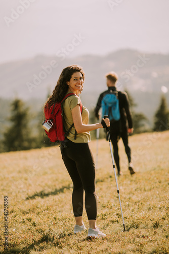 Smiling couple walking with...