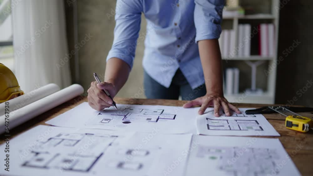 Closeup of hands engineer and architect team have a meeting and discussed about construction and architectural drawings works. Closeup of hands engineer and architect team have a meeting and discussed about construction and architectural drawings works.
