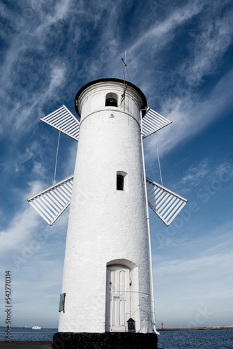 Old windmill lighthouse in Swinoujscie, a port in Poland on the Baltic Sea.