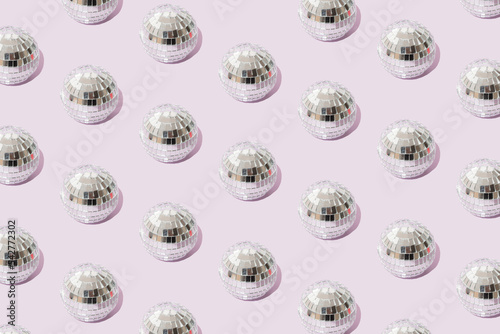 Disco ball on a light purple background. Minimal pattern.