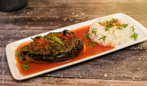 Karniyarik turkish hollowed aubergine stuffed with minced meat, served with rice