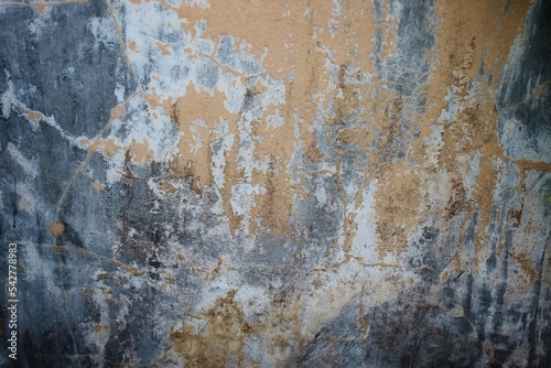 Dark background wall for vintage design. Cracks in the gray concrete surface, cracked old walls © Fahsop