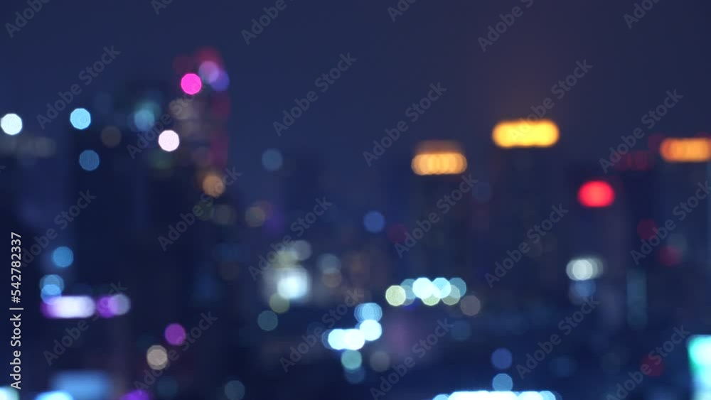 Abstract urban night light bokeh defocused background. Cityscape with skyscrapers horizontal 4k height resolutions 2160 x 3840