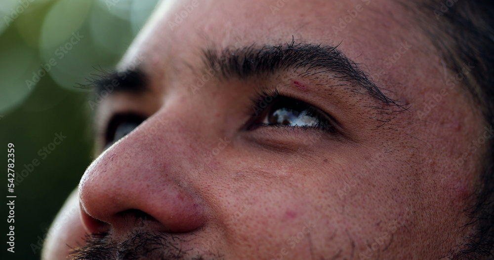 Man eyes looking at horizon in contemplation. Thoughtful pensive person Man eyes looking at horizon in contemplation. Thoughtful pensive person