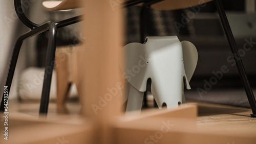 Designer Elefant toy behind wooden lamp