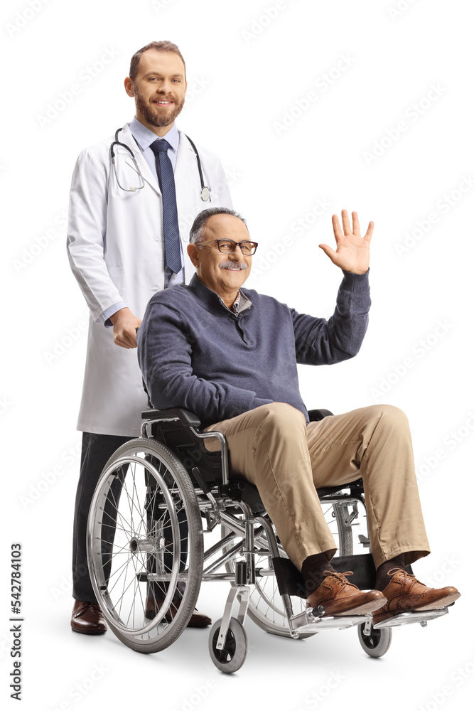 Doctor standing behind a mature man waving and sitting in a wheelchair Doctor standing behind a mature man waving and sitting in a wheelchair