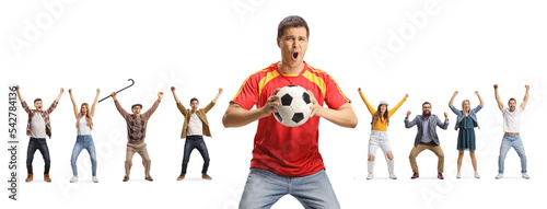 Excited football fan holding a ball and cheering with other people in the back