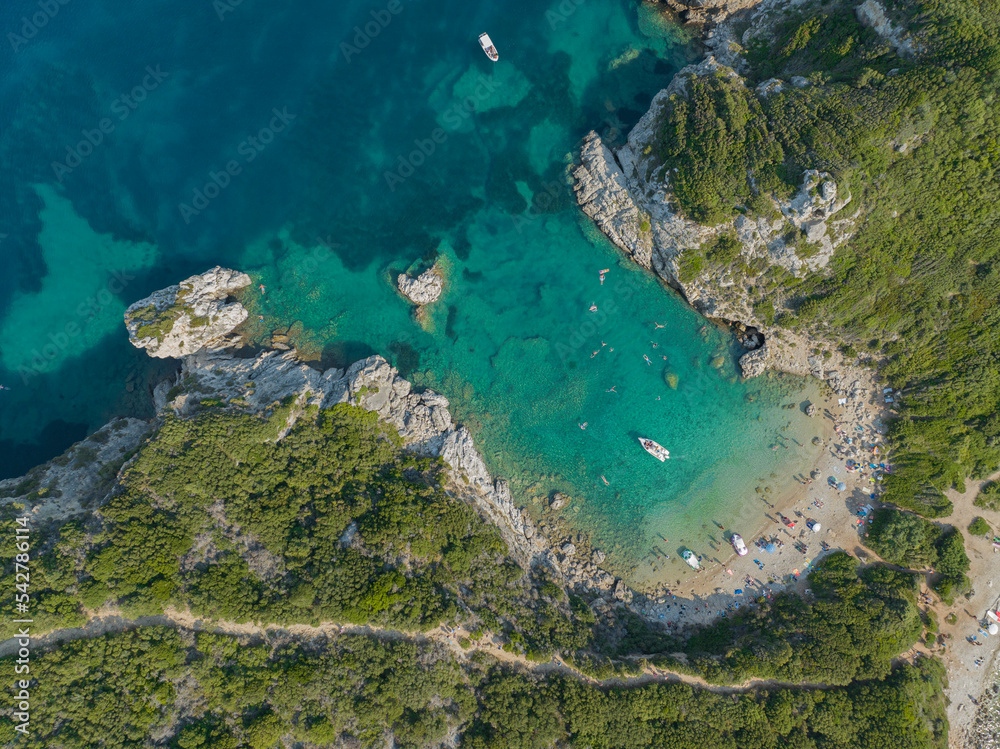 Fototapeta premium Aerial view of the coastline that lead to Porto Timoni beach, Corfu island, Greece. Thin strip that forms two beaches bathed by crystal clear waters