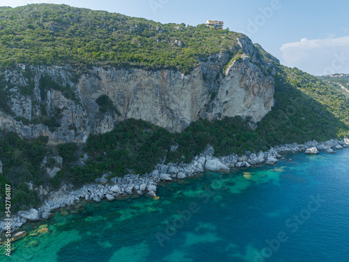 Fototapeta Naklejka Na Ścianę i Meble -  Aerial view of the coastline cliff that lead to Porto Timoni beach, Corfu island, Greece. Thin strip that forms two beaches bathed by crystal clear waters.
