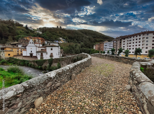 Cangas del Narcea, El Cascarin district where is El Carmen chapel and the roman bridge next to Narcea river, Asturias, Spain photo