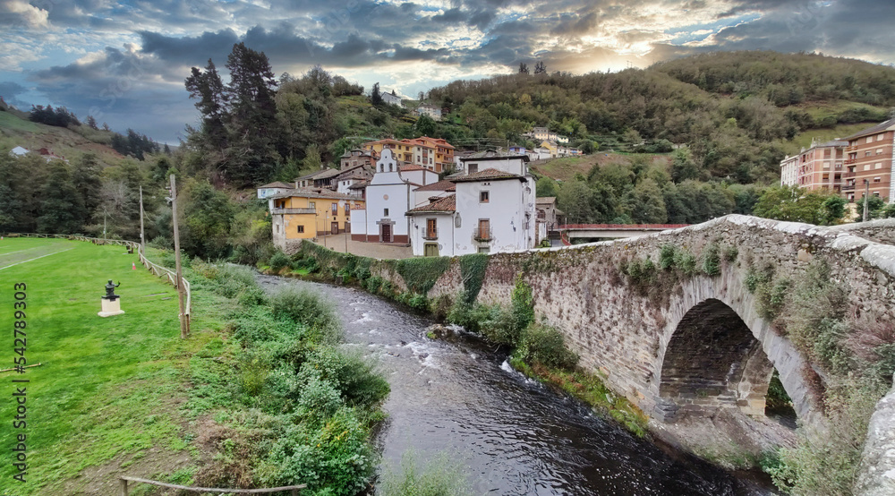 Cangas del Narcea, El Cascarin district where is El Carmen chapel and the roman bridge next to Narcea river, Asturias, Spain Cangas del Narcea, El Cascarin district where is El Carmen chapel and the roman bridge next to Narcea river, Asturias, Spain