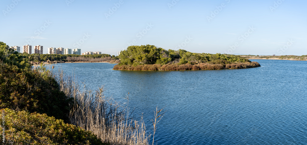 Pujol Lake in Valencia, in Albufera natural park in Valencia, Spain with building in background