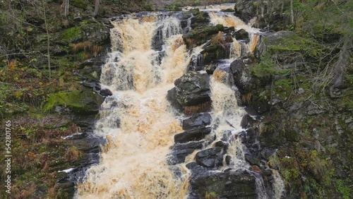 Big picturesque waterfall Jukankoski in the autumn forest. Karelia, Russia. 