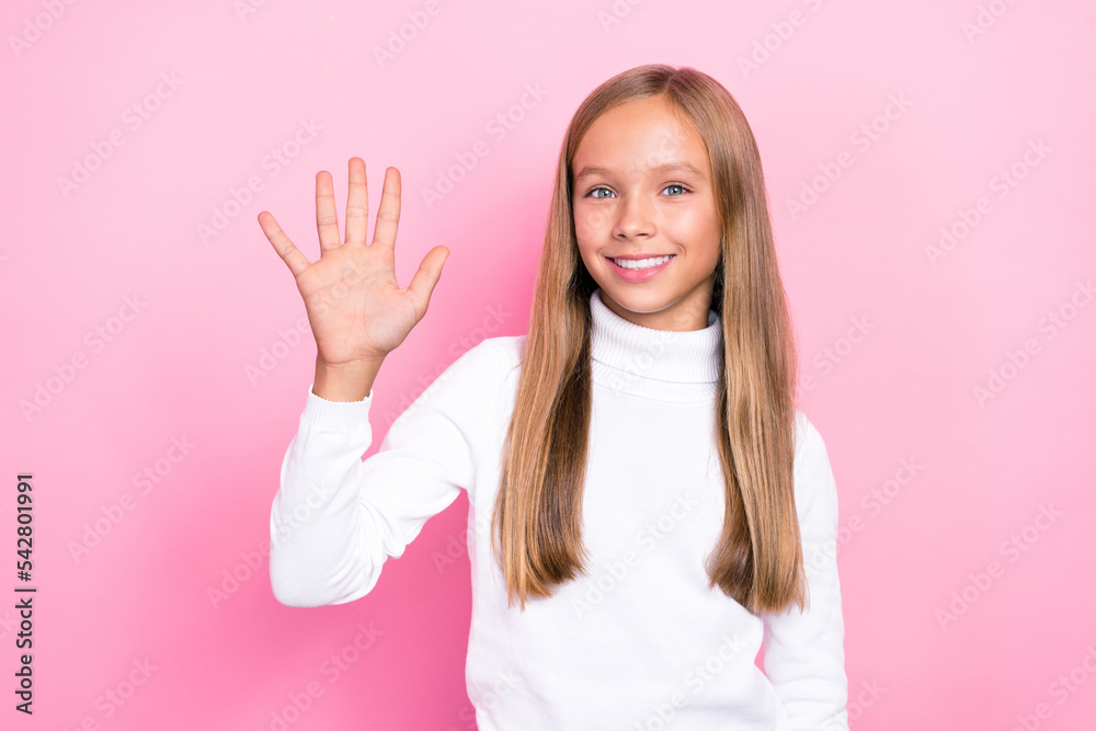 Photo of cheerful satisfied girl show arm say hi dressed white trendy pullover isolated on pink color background Photo of cheerful satisfied girl show arm say hi dressed white trendy pullover isolated on pink color background
