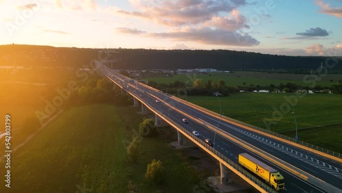 Evening highway traffic at sunset time from above photo