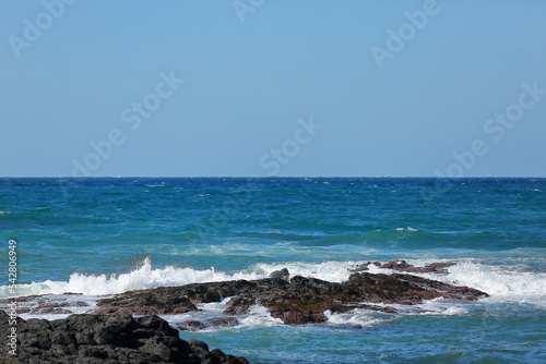 Look at the beautiful waves on the beach of Jeju Island. © Zorba