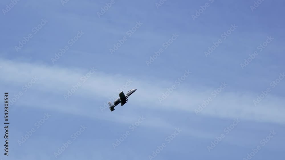 A10 Thunderbolt jet plane an US Air Force gunship in grey colour scheme against a blue sky, slow motion A10 Thunderbolt jet plane an US Air Force gunship in grey colour scheme against a blue sky, slow motion
