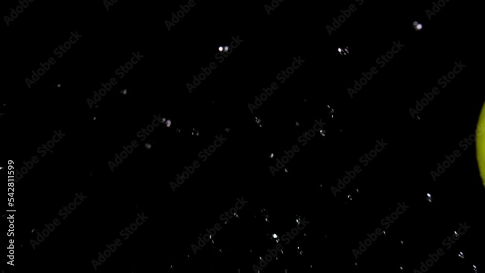 Close-up of the two red apples are hitting each other on the black background Close-up of the two red apples are hitting each other on the black background