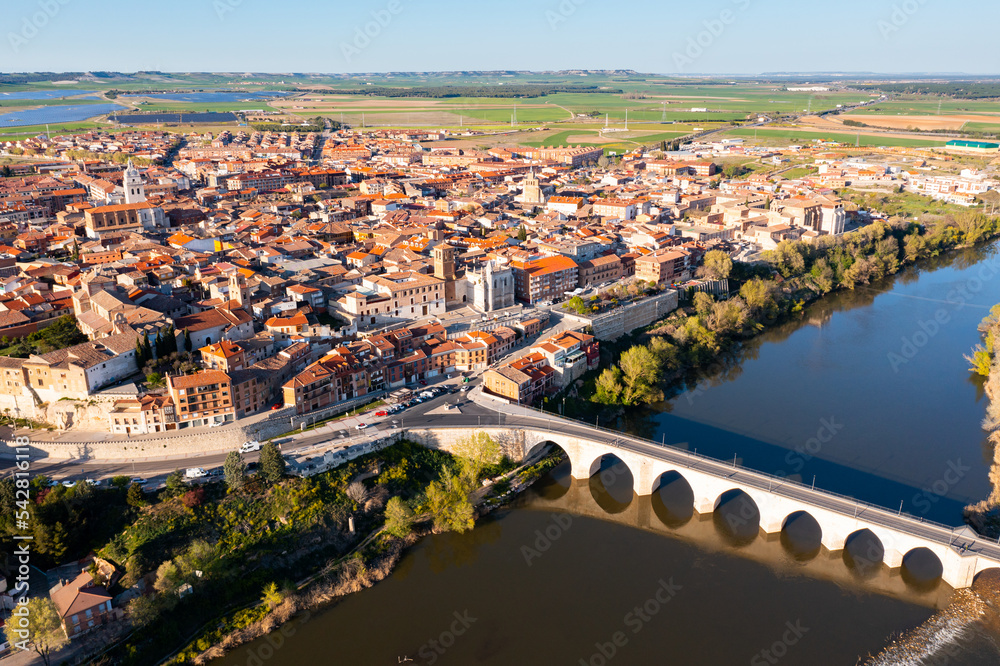 Aerial view on the old stone bridge of Douro river and old town Tordesillas. Spain