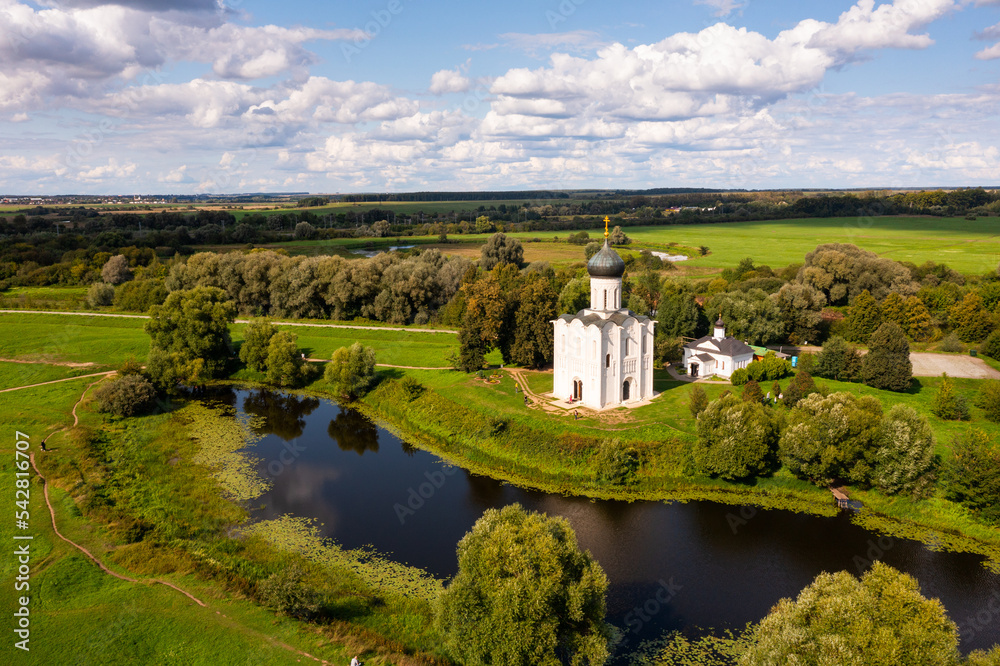 Drone view of the ancient white-stone Church of the Intercession on the Nerl on a summer day, located in the Vladimir region, ..Russia