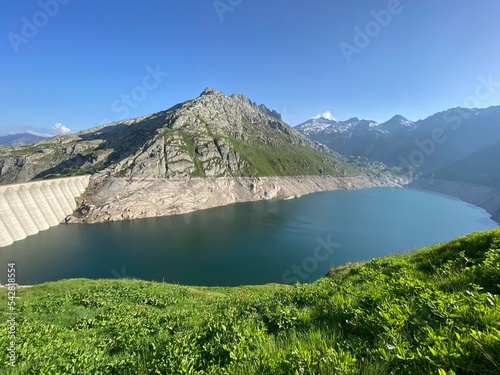 Artificial reservoir lake Lago di Lucendro or accumulation lake Lucendro in the Swiss alpine area of the St. Gotthard Pass (Gotthardpass), Airolo - Canton of Ticino (Tessin), Switzerland (Schweiz) photo