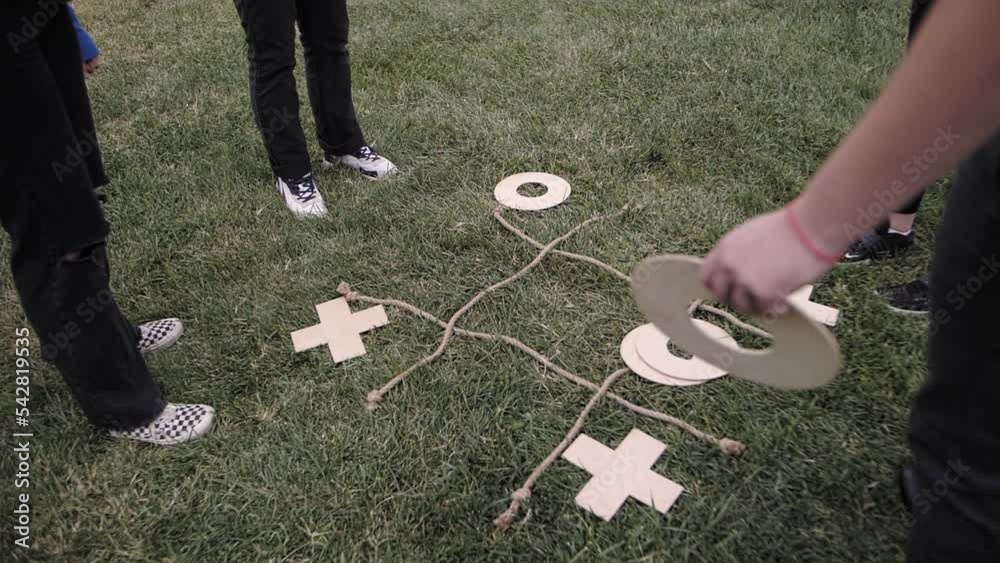 a company of people playing tic tac toe