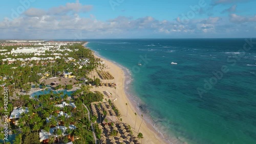 Aerial view of beach and hotels on the coast of the Atlantic Ocean in the Dominican Republic. Paradise Beach in the Dominican Republic. The coast of the Atlantic Ocean in Punta Cana. Palm trees. photo