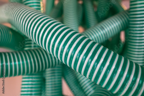 Corrugated pipe  green-white  used for industrial purposes. Flatley. 