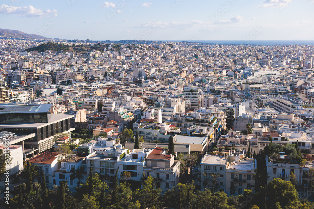 Obraz premium Athens, Attica, beautiful super-wide angle view of Athens city, Greece, Mount Lycabettus, mountains and scenery beyond the city, seen from The Parthenon, temple on the Athenian Acropolis