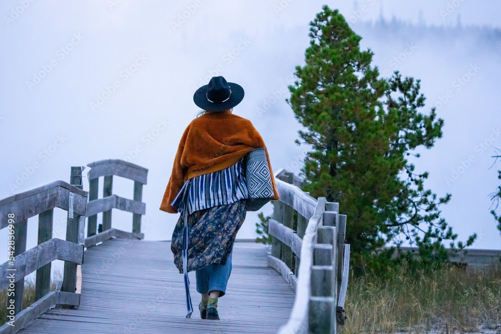Fashionable Tourist on Boardwalk to Biscuit Basin in Yellowstone National Park Fashionable Tourist on Boardwalk to Biscuit Basin in Yellowstone National Park