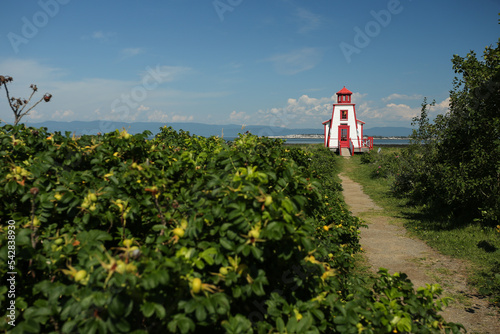 Phare de St-André-de-Kamouraska lighthouse with path on the shore of St-Laurence river, Bas St-Laurent. Quebec Canada