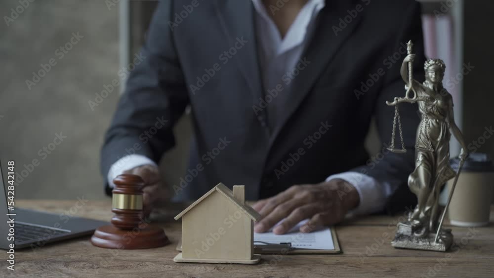 Online auctions for real estate homeowners, buying, selling or foreclosure ideas. A model of a judge's house holding a hammer and a computer next to it. Ideas for Judging a Residential Business 4k Online auctions for real estate homeowners, buying, selling or foreclosure ideas. A model of a judge's house holding a hammer and a computer next to it. Ideas for Judging a Residential Business 4k