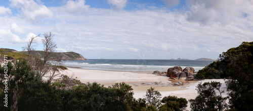 Panoramic of Whiskey bay beach and surrounding native bush land, famous red rocks, Wilson's Promontory National Park, Victoria, Australia photo