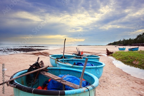 Coracle fishing boats on beach. Mui Ne, Phan Tiet, Vietnam photo