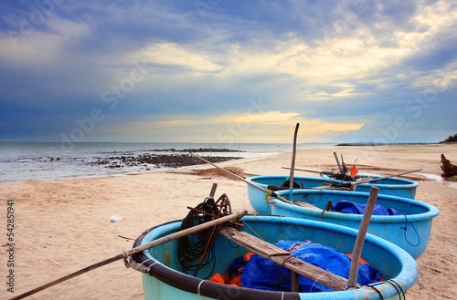 Coracle fishing boats on beach. Mui Ne, Phan Tiet, Vietnam photo