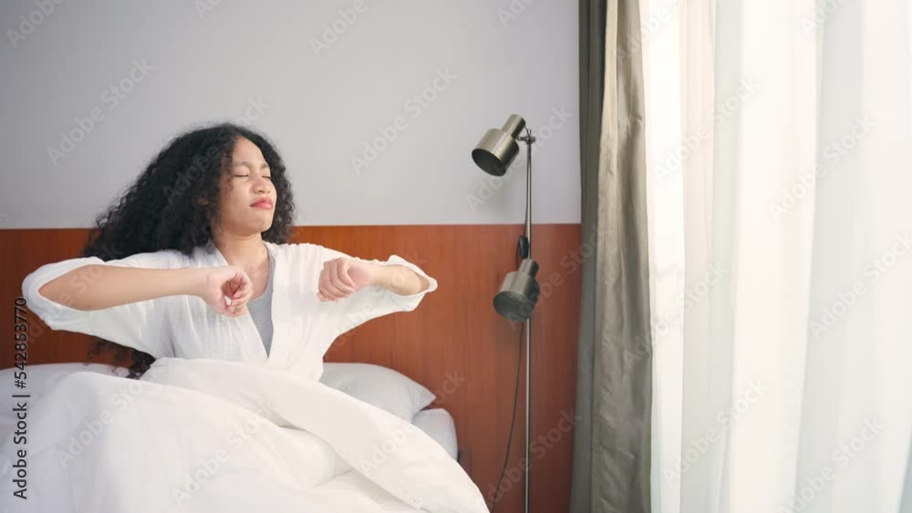 Beautiful Caucasian girl in pajamas wake up and stretching morning. Beautiful Caucasian girl in pajamas wake up and stretching morning.