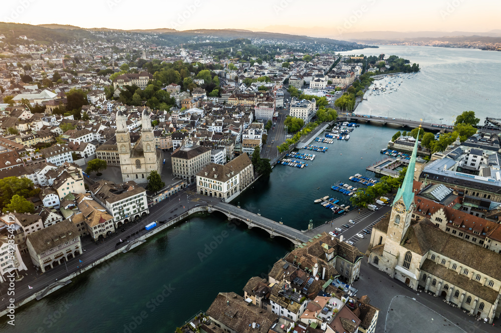 Aerial drone shot flying above Lake Zurich, Switzerland in sunny day.