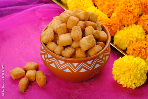 Shakkar pare / Shakkarpare / shankar pale is a sweet tea time snack food from India, Traditional homemade indian maharashtrian Diwali Festival sweet snack food.